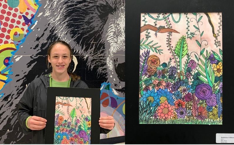 Madeleine with her artwork that was displayed in City Hall.